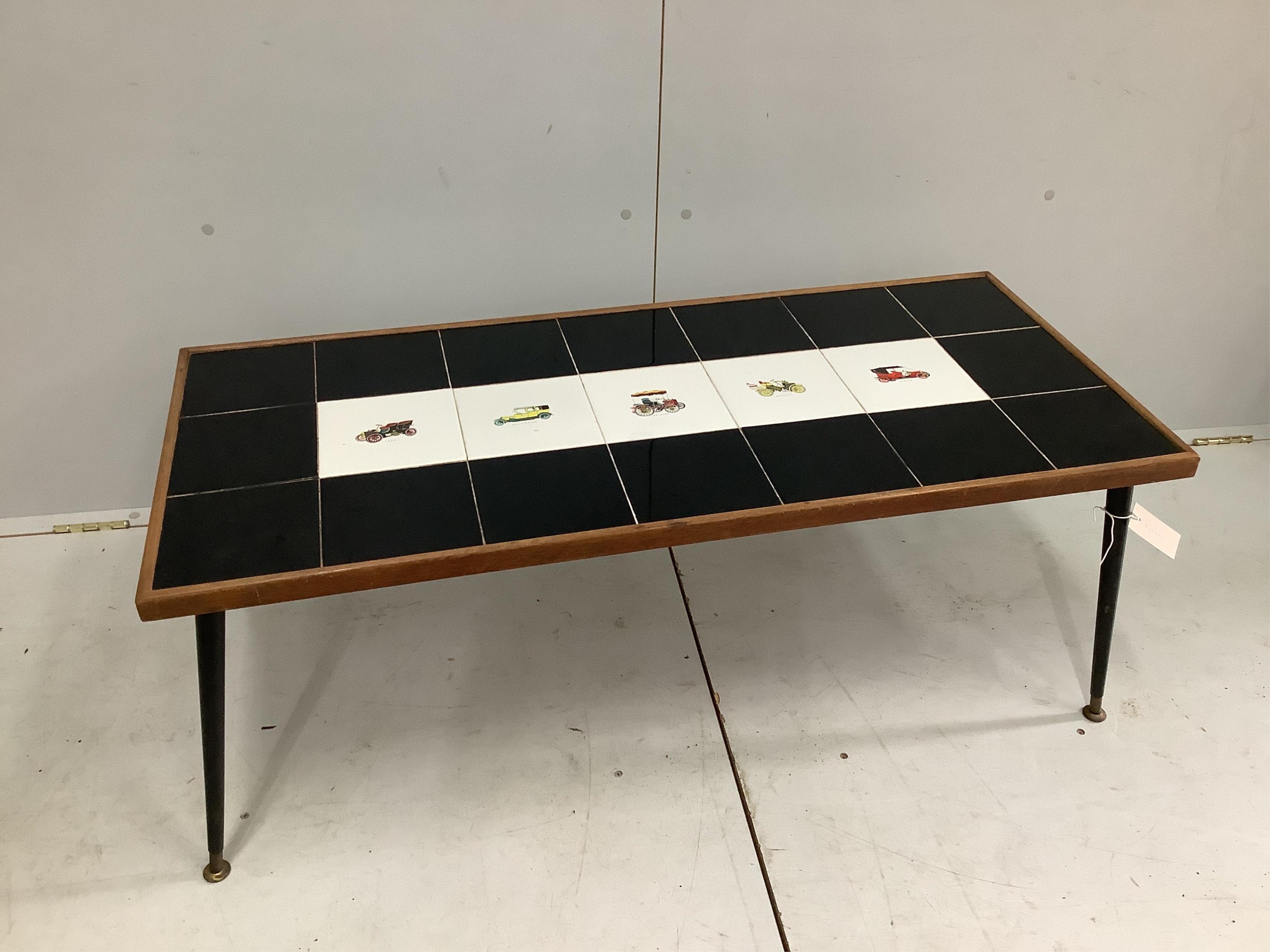 A 1960s tile top coffee table, width 110cm, depth 48cm, height 51cm. Condition - fair to good